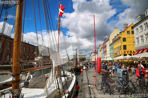 Image of COPENHAGEN, DENMARK - AUGUST 14, 2016: Boats in the docks Nyhavn