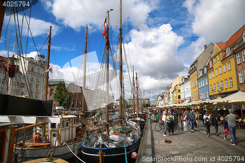 Image of COPENHAGEN, DENMARK - AUGUST 14, 2016: Boats in the docks Nyhavn