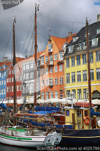 Image of COPENHAGEN, DENMARK - AUGUST 14, 2016: Boats in the docks Nyhavn
