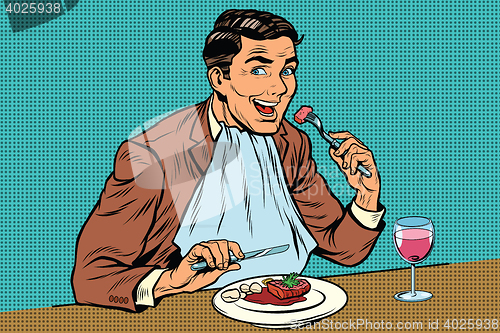 Image of Elegant retro man eats in the restaurant and drinking wine