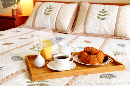 Image of Breakfast on a bed in a hotel room