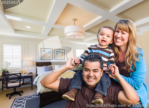 Image of Mixed Race Family In New Custom Bedroom