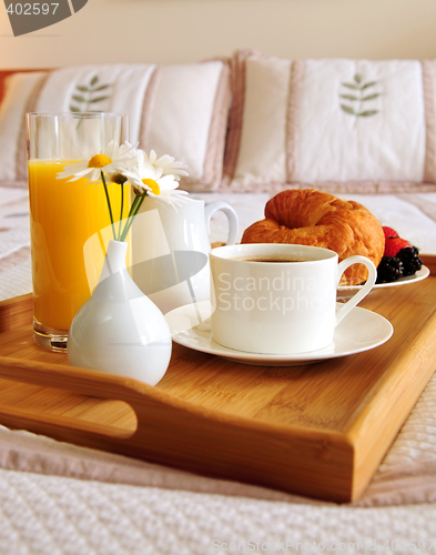 Image of Breakfast on a bed in a hotel room