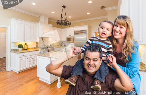 Image of Young Mixed Race Family Having Fun in Custom Kitchen