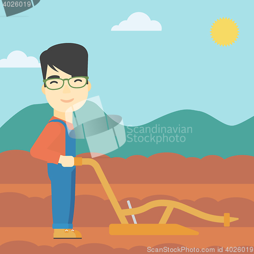 Image of Farmer on the field with plough.