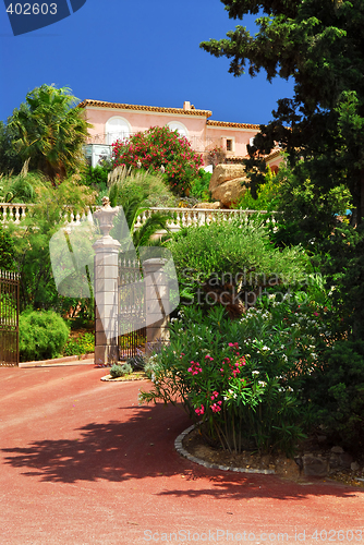 Image of Lush garden in front of a villa
