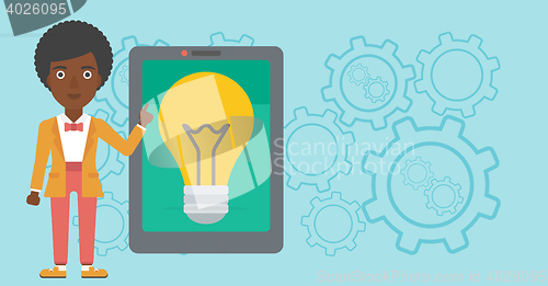 Image of Woman pointing at big tablet computer.