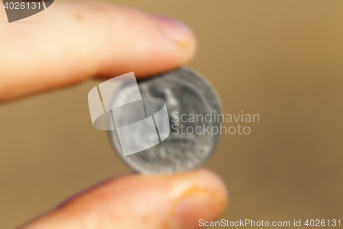 Image of coin in hand