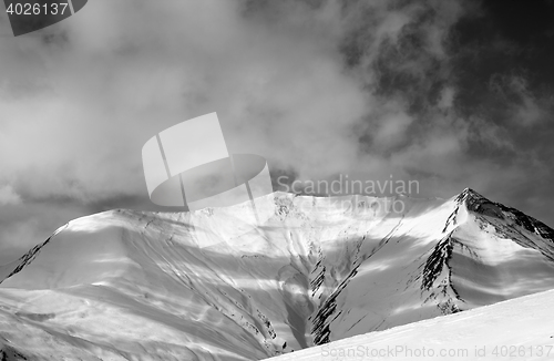 Image of Black and white view on off-piste snowy slope in wind day