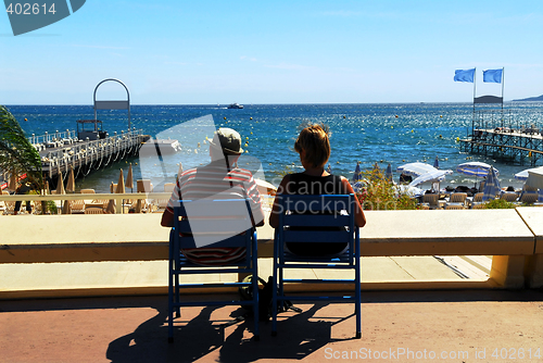 Image of Couple relaxing in chairs in Cannes