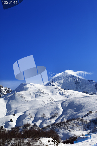 Image of Mount Tetnuldi and off-piste slope with track from ski and snowb