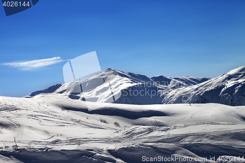 Image of Off-piste ski slope in sunny evening