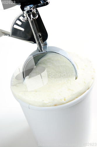 Image of Tub of vanilla ice cream with a scoop