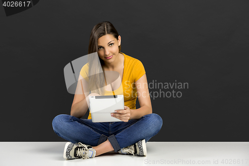 Image of Woman working with a tablet