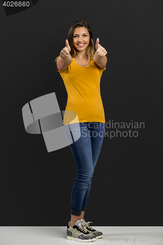 Image of Happy woman with thumb up