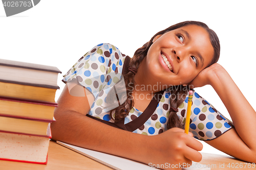 Image of Pretty Hispanic Girl Daydreaming While Studying on White