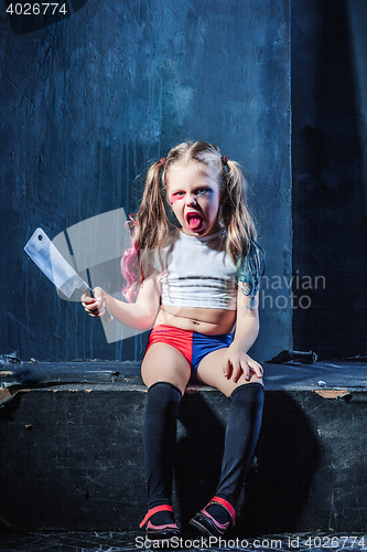 Image of Bloody Halloween theme: The funny crasy girl with knife