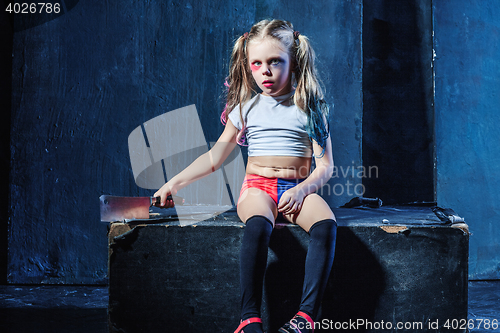 Image of Bloody Halloween theme: The funny crasy girl with knife