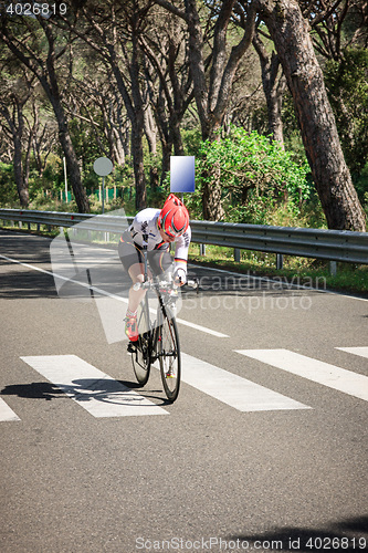 Image of Grosseto, Italy - May 09, 2014: The cyclist without an arm and feet with the bike during the sporting event