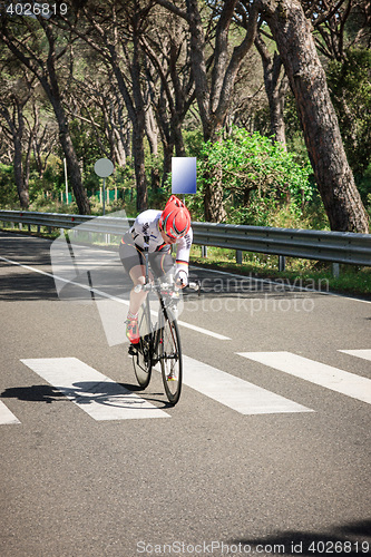 Image of Grosseto, Italy - May 09, 2014: The cyclist without an arm and feet with the bike during the sporting event