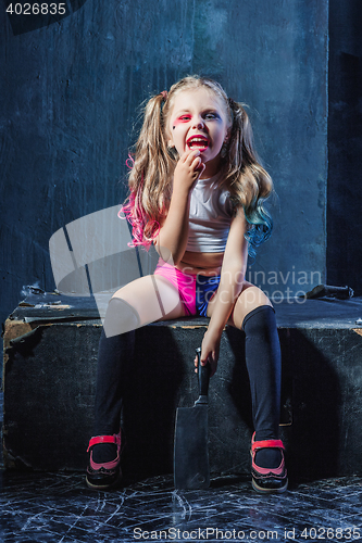 Image of Horror shot: a scary evil girl with bloody knife
