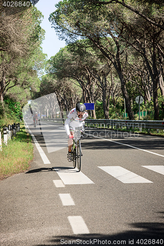 Image of Grosseto, Italy - May 09, 2014: The cyclist without an arm and feet with the bike during the sporting event