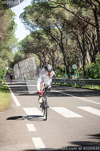 Image of Grosseto, Italy - May 09, 2014: The cyclist without an arm and feet with the bike during the sporting event