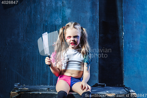 Image of Horror shot: a scary evil girl with bloody knife