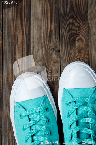 Image of socks of shoes on wooden floor