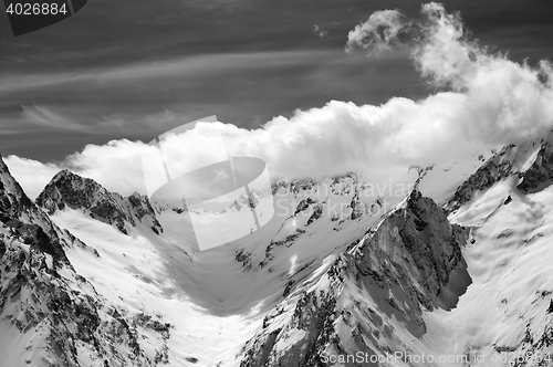 Image of Black and white winter mountains in clouds