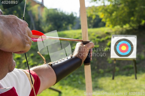 Image of Medieval archer shoot at a target