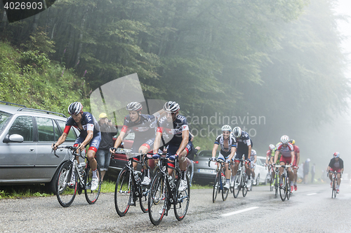 Image of The Peloton in a Misty Day - Tour de France 2014