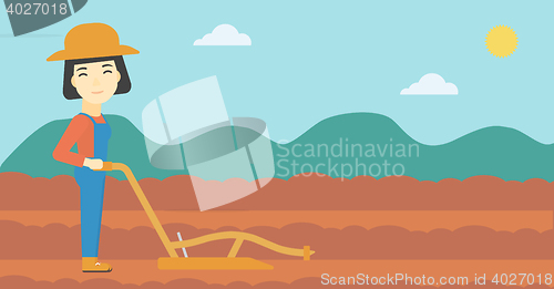 Image of Farmer on the field with plough.