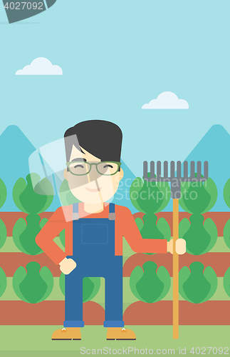 Image of Farmer with rake vector illustration.