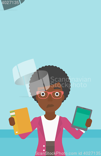 Image of Woman choosing between book and tablet computer.