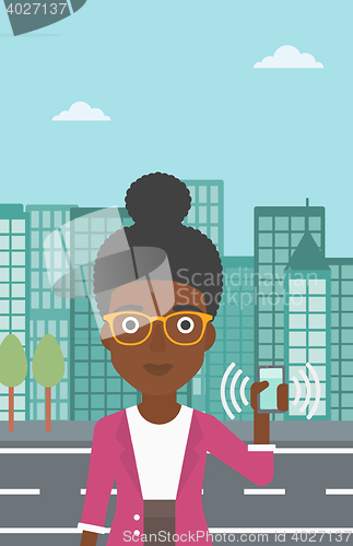 Image of Woman holding ringing telephone.