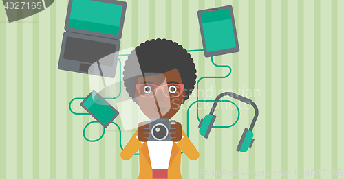 Image of Woman surrounded with her gadgets.