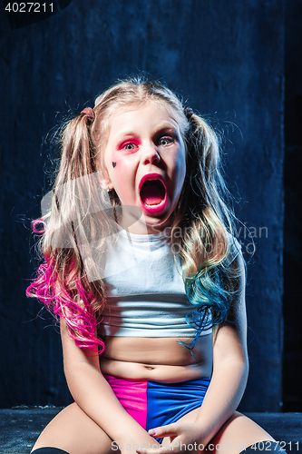 Image of The funny crasy girl on dark background