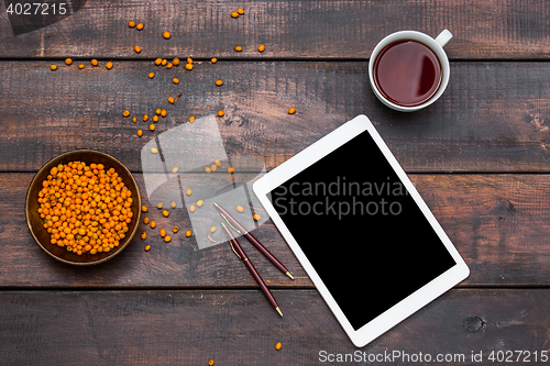 Image of Office desk table with laptop and coffee cup.