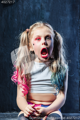 Image of The funny crasy girl on dark background