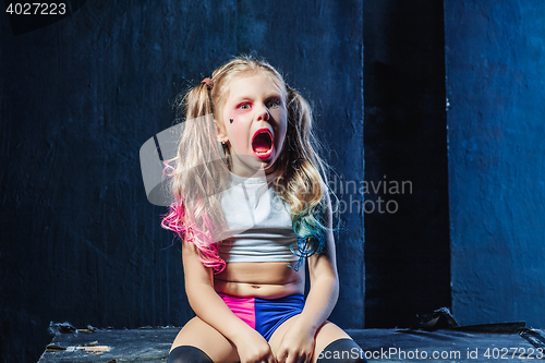 Image of The funny crasy girl on dark background