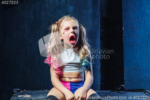 Image of The funny crasy girl on dark background