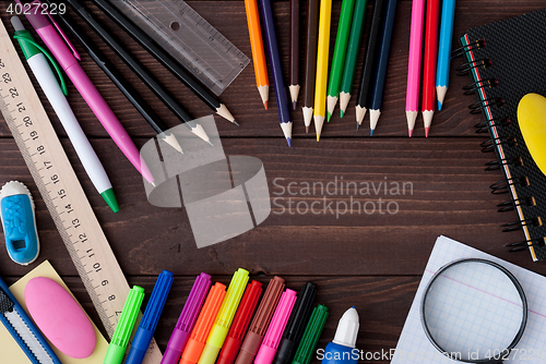 Image of School supplies on a wooden table