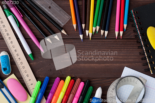 Image of School supplies on a wooden table