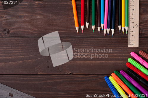 Image of Colored pencils on a wooden board