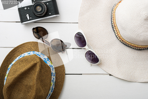 Image of Beach accessories on wooden board