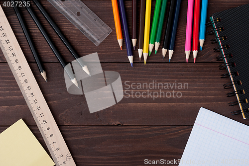 Image of School supplies on a wooden table