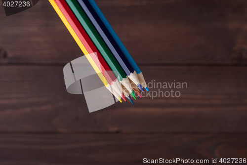 Image of Colored pencils on a wooden board