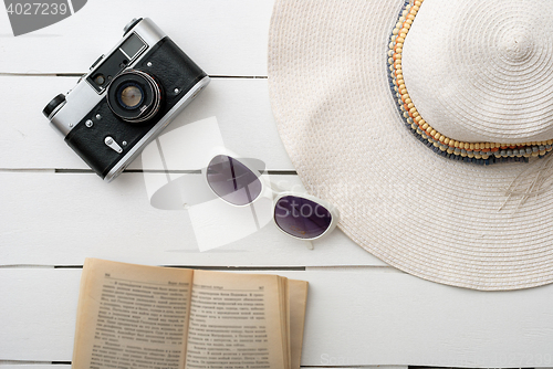 Image of Beach accessories on wooden board