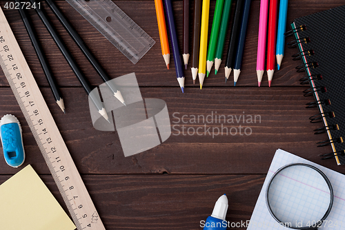 Image of School supplies on a wooden table